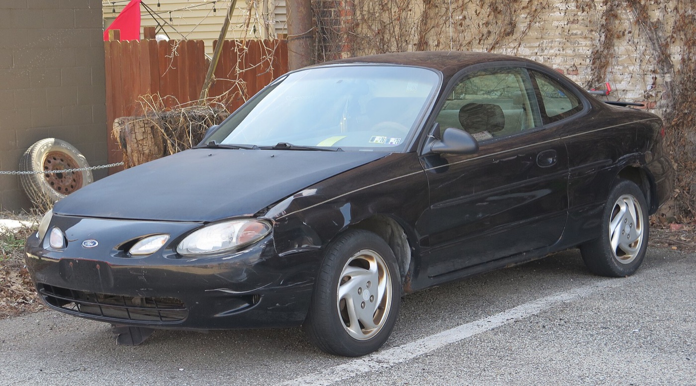 Black 2000 Ford ZX2 from the front left, on the standard 15-inch swirl alloy wheels