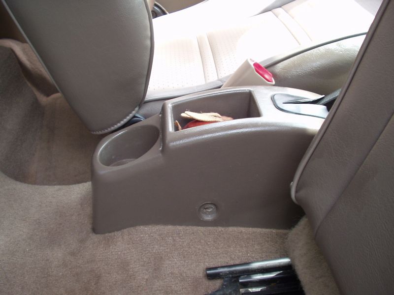 The ZX2 center console with the armrest removed, showing the cup holders and mounting area
