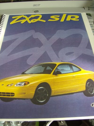 Press kit cover: ZX2 S/R lettering in yellow over a yellow ZX2 coupe on a purple background